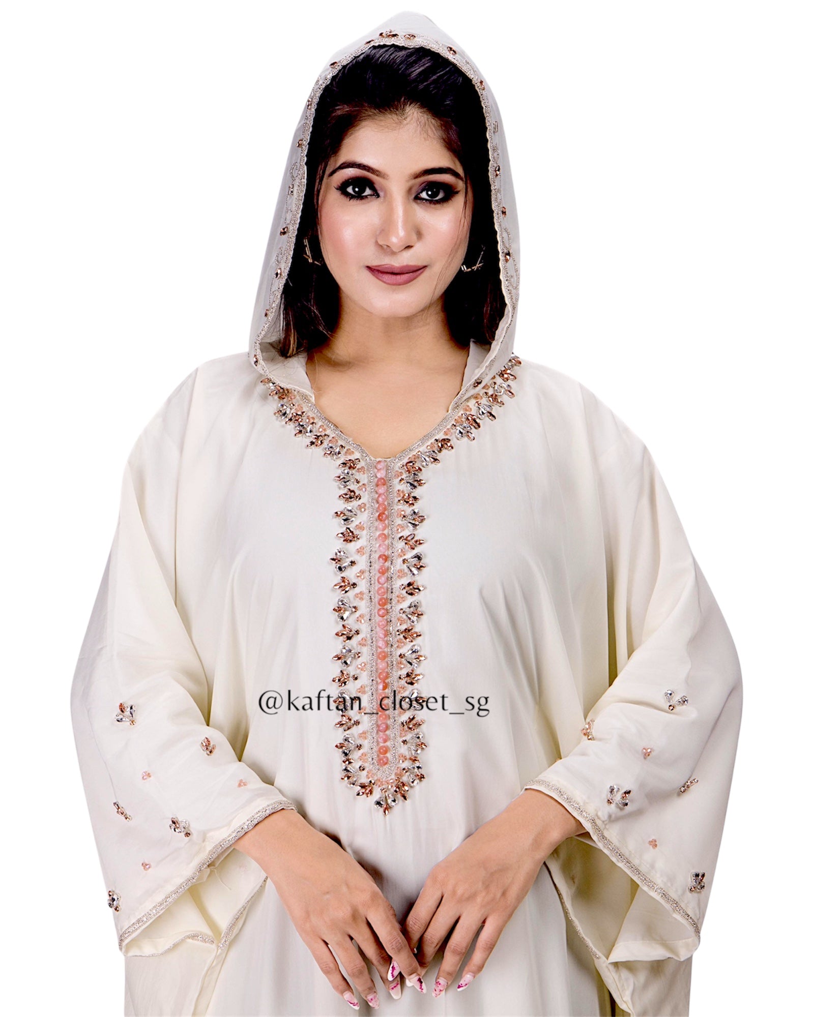 Close up of Model wearing cream white hoodie style embelished kaftan